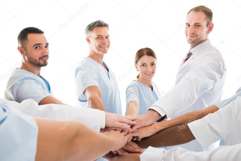 Smiling Medical Team Piling Hands