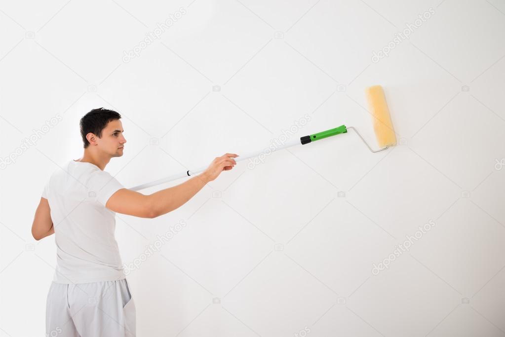 Man Using Paint Roller