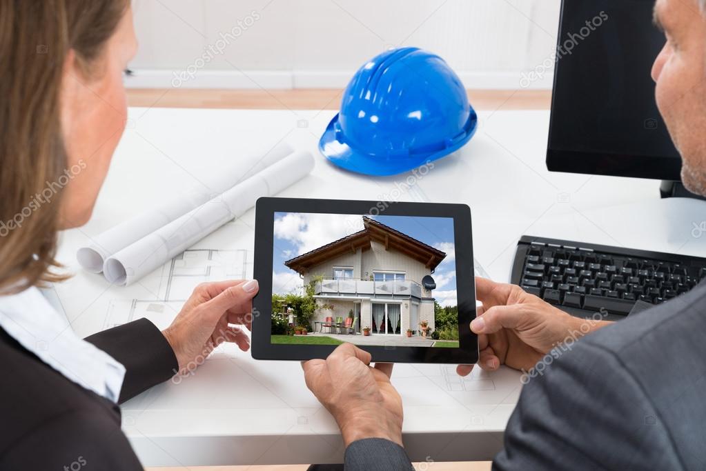 Two Architects Looking At House