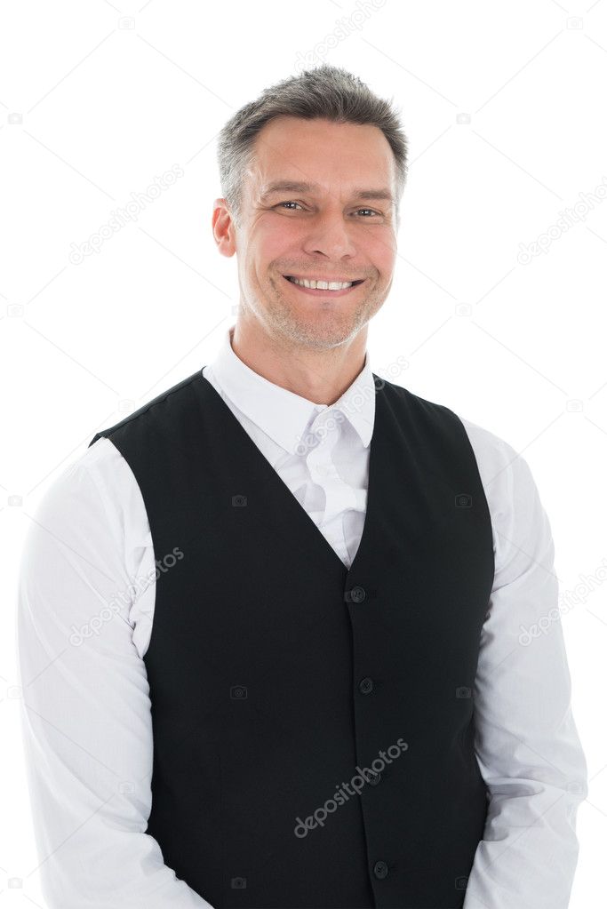 Portrait Of Happy Mature Waiter