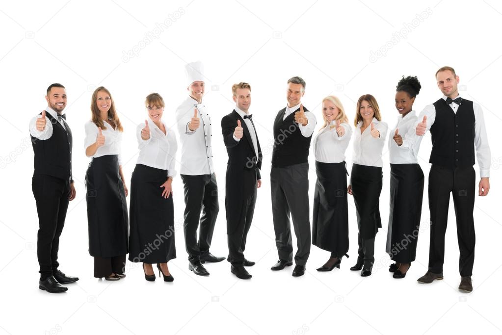 Confident Restaurant Staff Standing In Row