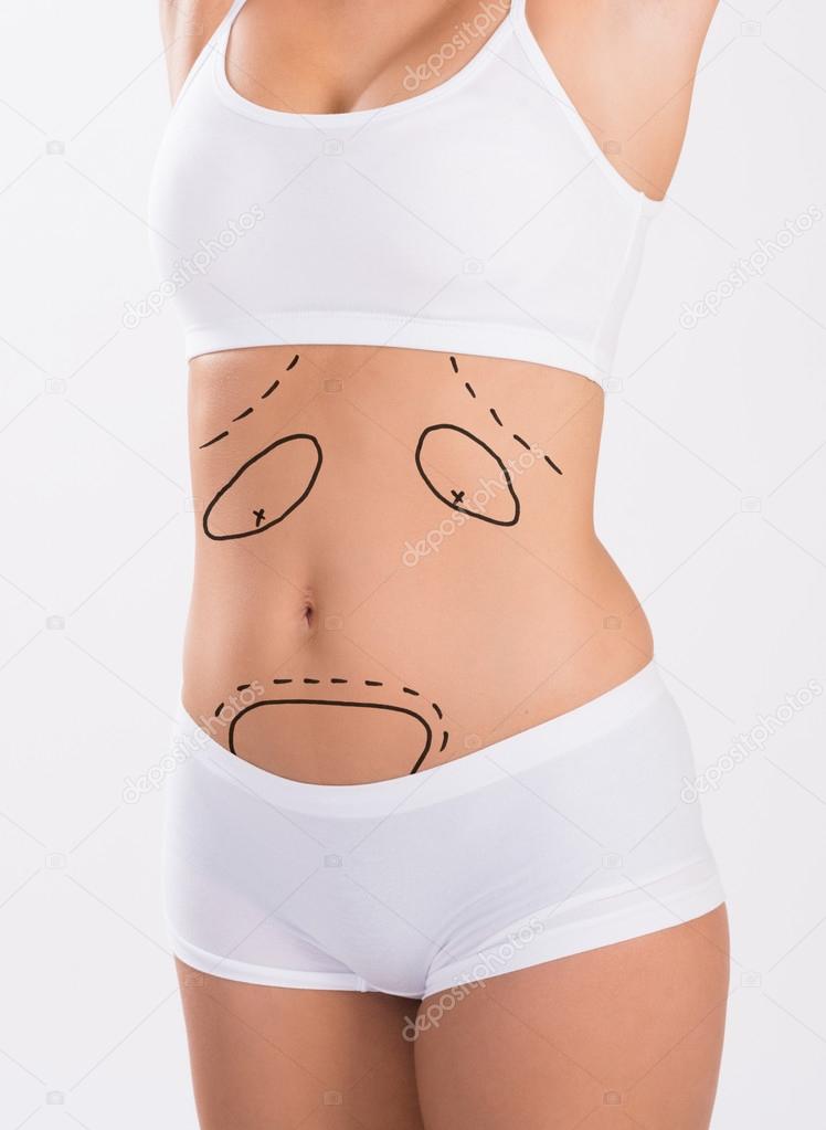 Midsection Of Woman With Markings On Stomach