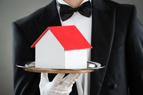 Waiter Holding House Model In Tray — Stock Photo, Image