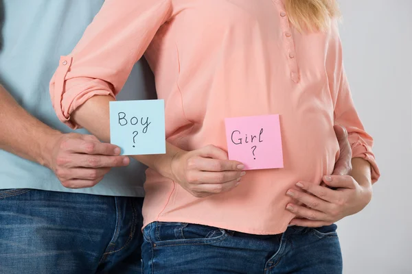 Expecting Couple Holding Papers — Stock Photo, Image