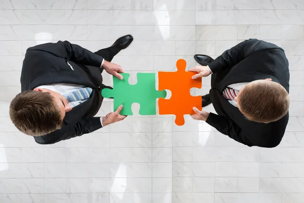 Businessmen Assembling Jigsaw Puzzle — Stock Photo, Image