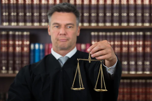 Judge Holding Justice Scale In Courtroom — Stock Photo, Image