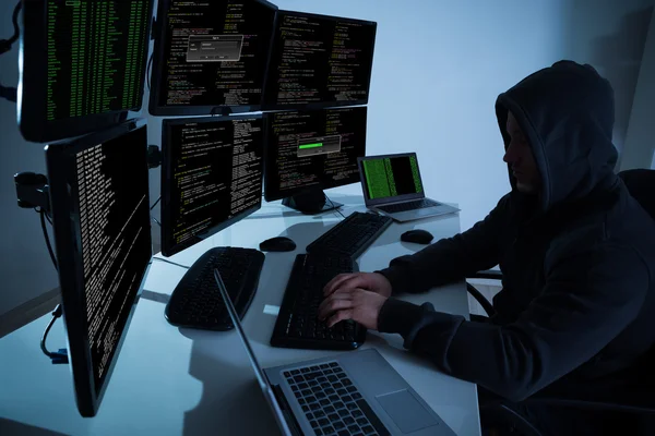 Hacker Using Computers To Steal Data