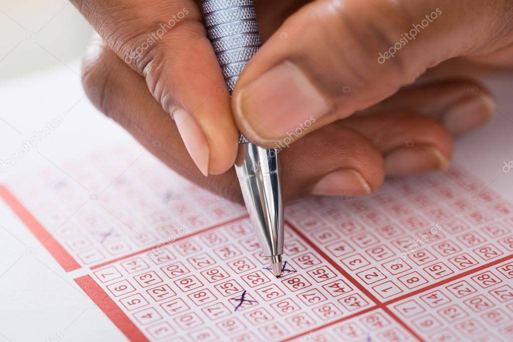 Person Marking Number On Lottery Ticket
