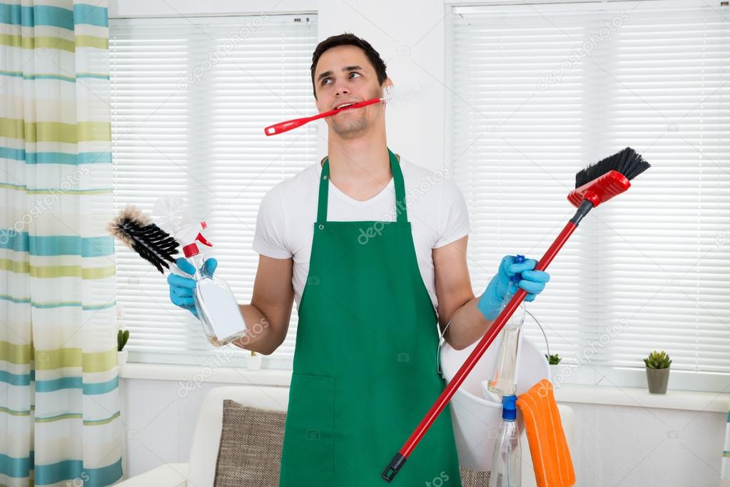 Overburdened Cleaner Holding Cleaning Equipment