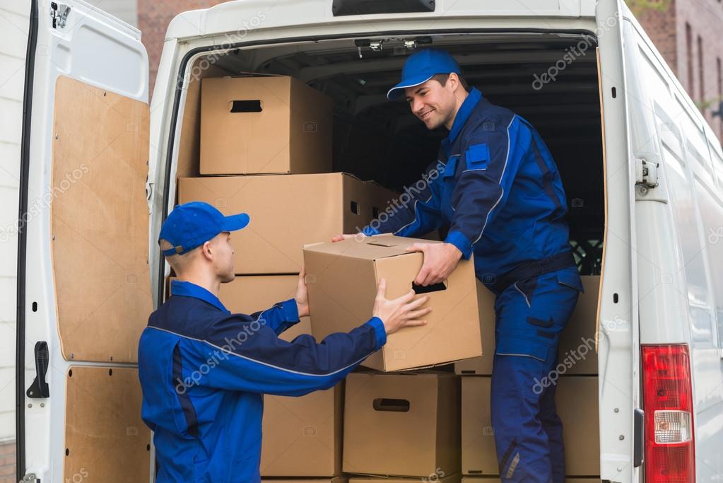 Delivery Men Unloading Boxes From Truck — Stock Photo © AndreyPopov 95377120