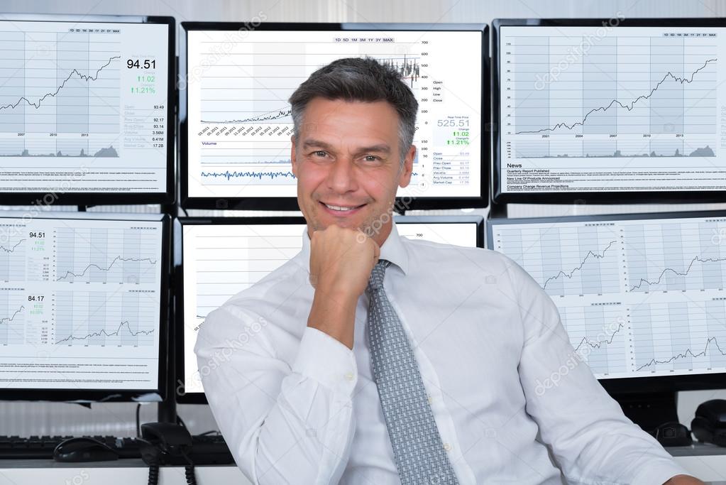 Market Broker Leaning On Desk