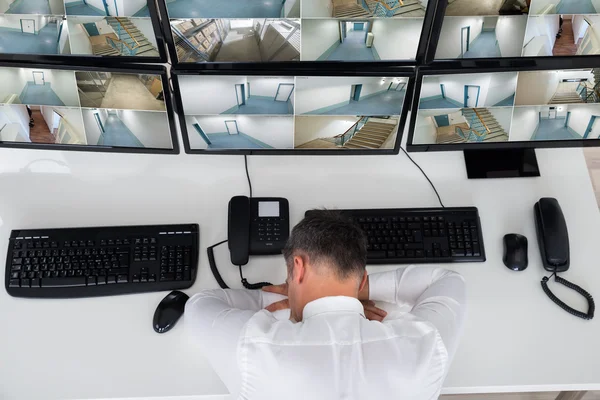 Operator Sleeping On Security Monitor's Desk — Stock Photo, Image