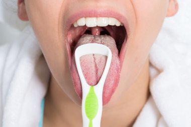 Woman Cleaning Tongue clipart