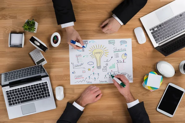 Businessmen Making Strategy At Wooden Desk — Stock Photo, Image