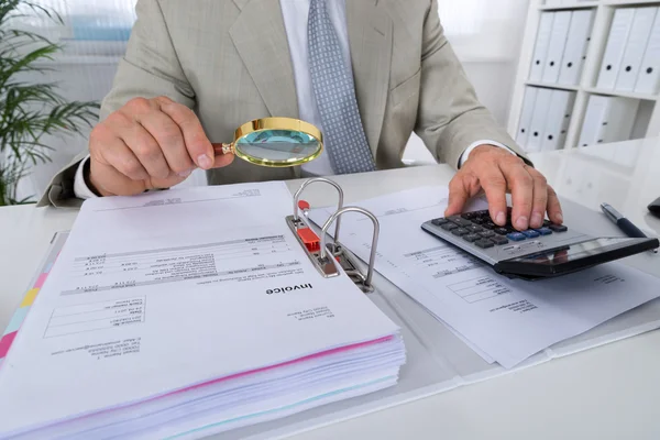 Accountant Holding Magnifying Glass — Stock Photo, Image