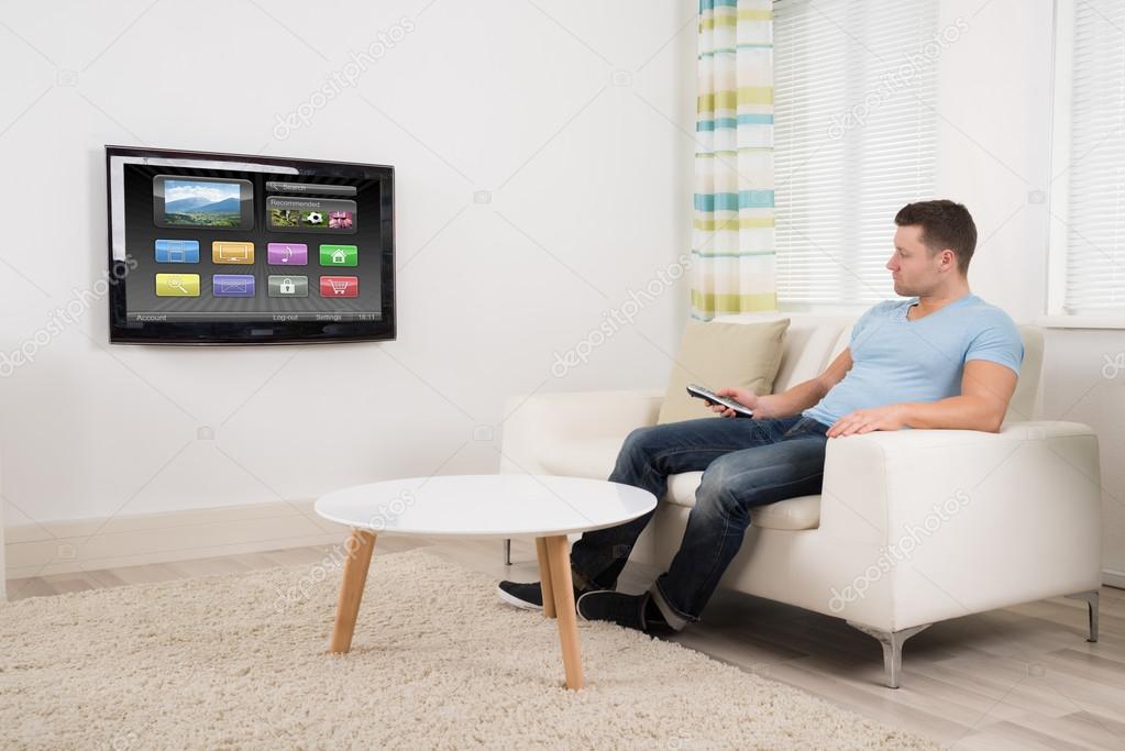 Man Watching Television At Home