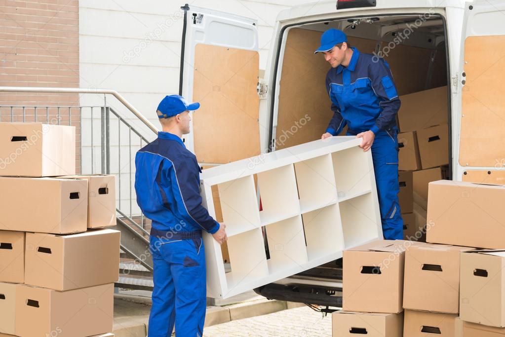 Movers Unloading Furniture From Truck