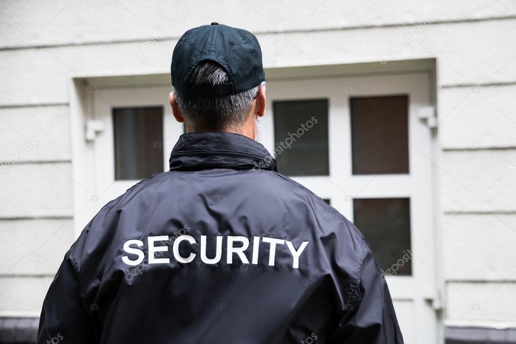 Security Guard Standing Outside Building