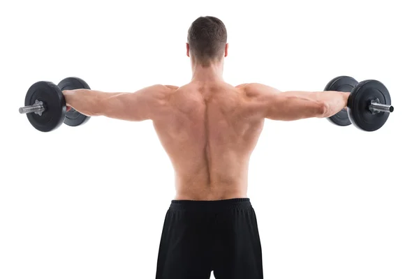 Homem muscular levantando halteres — Fotografia de Stock