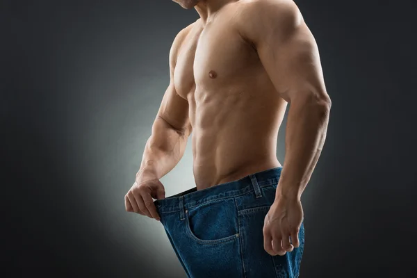 Man In Jeans Showing Weight Loss — Stock Photo, Image