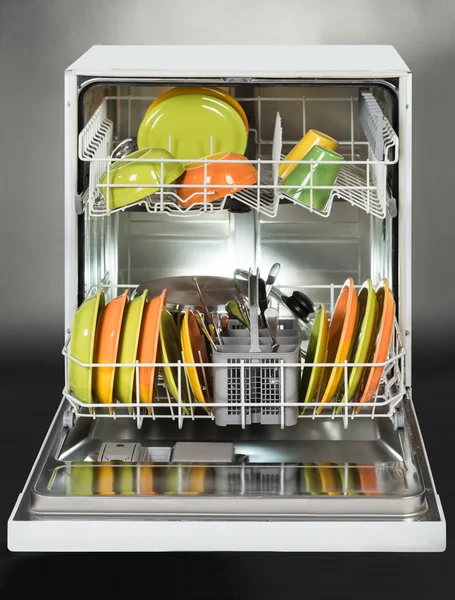 Dishwasher full of utensils isolated — Stock Photo, Image