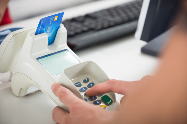 Customer's Hand Entering Pin Code