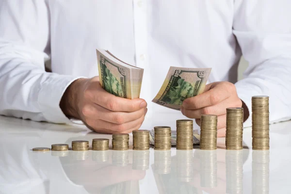 Businessman Counting Money At Desk — Stock Photo, Image