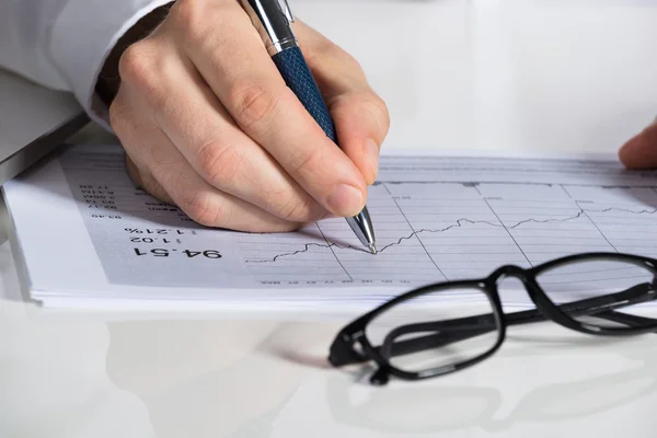 Businessman Preparing Financial Chart At Desk Royalty Free Stock Images