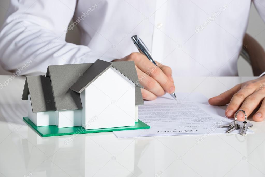 Businessman Signing House Contract