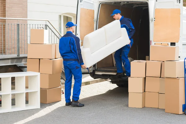 Movers Unloading Sofa From Truck — Stock Photo, Image
