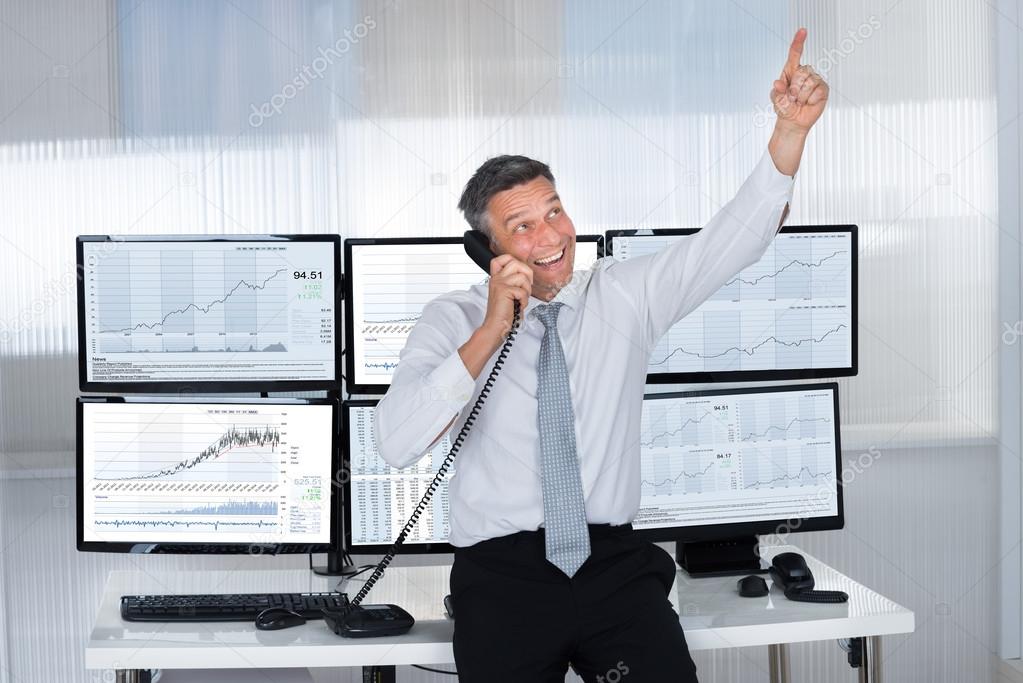 Happy Stock Trader Pointing Upwards
