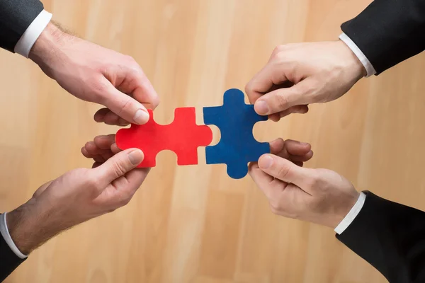 Businessmen Assembling Jigsaw Puzzle — Stock Photo, Image