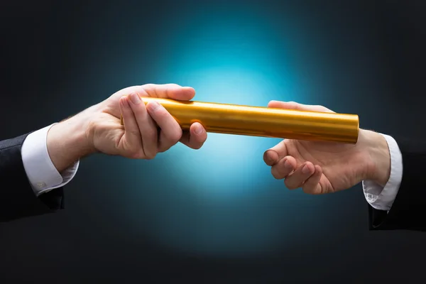 Businessman Passing Relay Baton — Stock Photo, Image