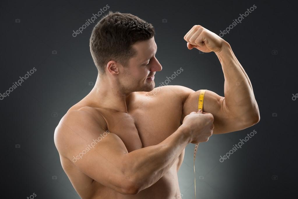 Bodybuilder Measuring Biceps With Tape Measure Stock Photo - Download Image  Now - 2015, Abdominal Muscle, Adult - iStock