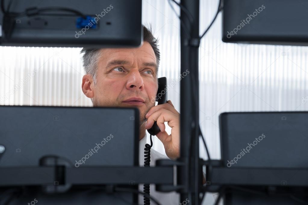 Stock Trader Looking At  Computer Screens