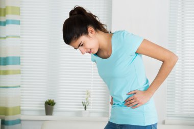 Woman Suffering From Stomach Ache clipart