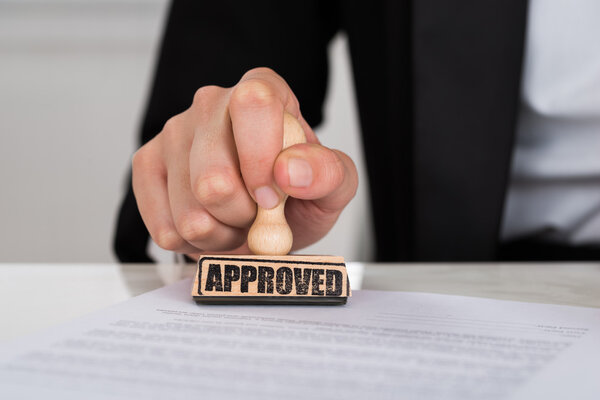 Businesswoman Stamping Approved On Contract