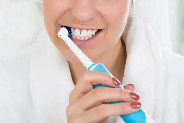 Woman In Bathrobe Brushing Teeth — Stock Photo, Image