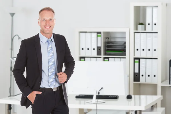 Confident Businessman Standing In Office — Stock Photo, Image