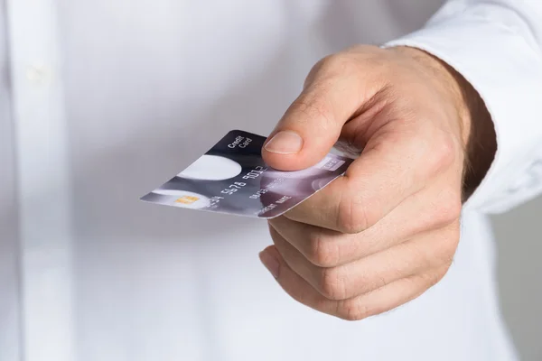 Businessman holding credit card — Stock Photo, Image