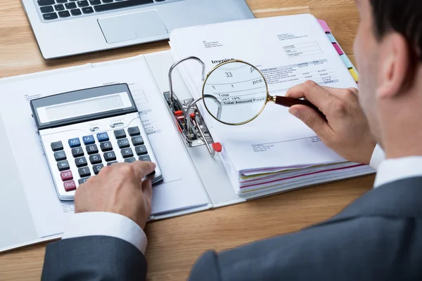 Businessman Examining Invoice — Stock Photo, Image