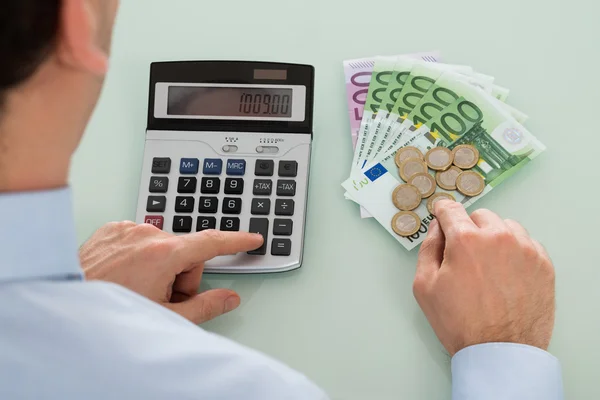 Businessperson Using Calculator On Desk — Stock Photo, Image