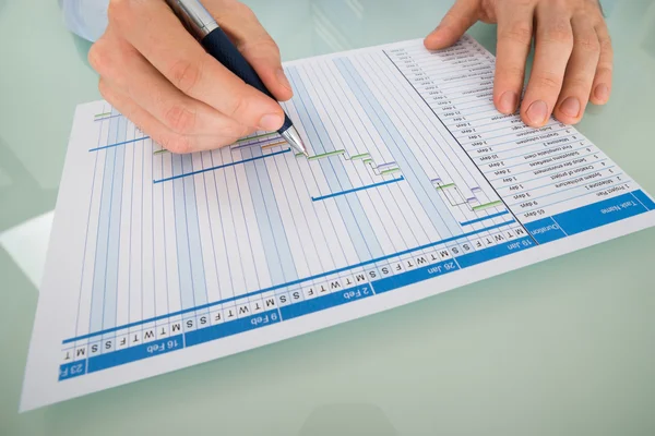 Businessman With Pen Working with Chart — Stock Photo, Image