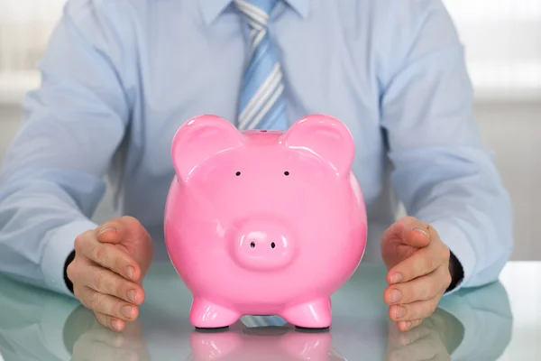 Businessman with Piggy Bank — Stock Photo, Image