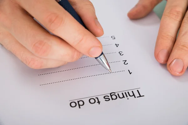 Person Handschrift auf der Liste — Stockfoto