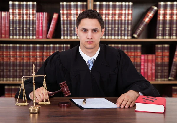 Young Judge Striking The Gavel — Stock Photo, Image