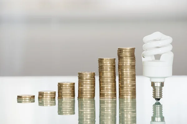 Light Bulb And Stacked Coins — Stock Photo, Image