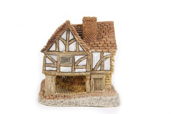 Miniaturní dům izolovaný na bílém — Stock fotografie