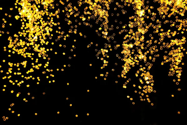 Golden glitter sparkle on black background — Stock Photo, Image