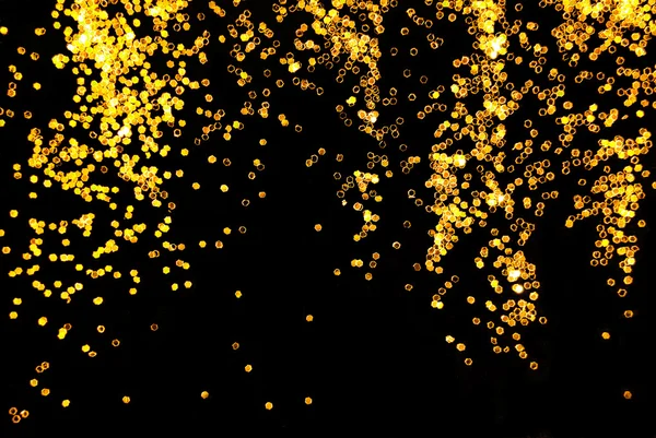 Goldglitzern auf schwarzem Hintergrund — Stockfoto